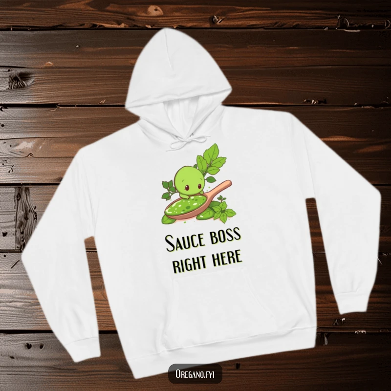 Funny hoodie print: An adorable oregano leaf character exploring a vast spoonful of pesto, embodying culinary curiosity and joy for a cozy feel.