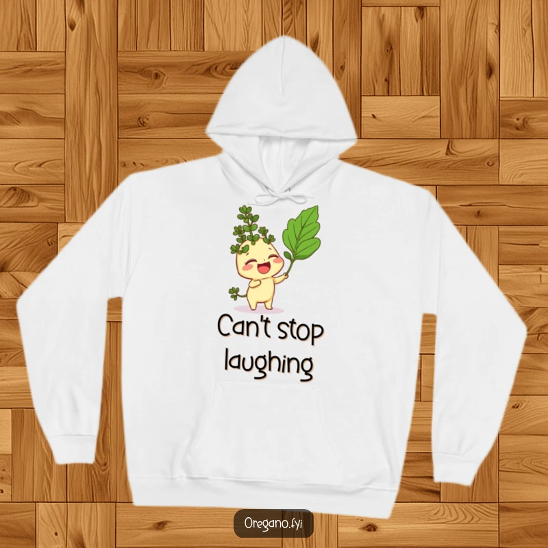 Funny hoodie with a giggling oregano sprig character being playfully tickled by a curry leaf, cozy and full of mirth.