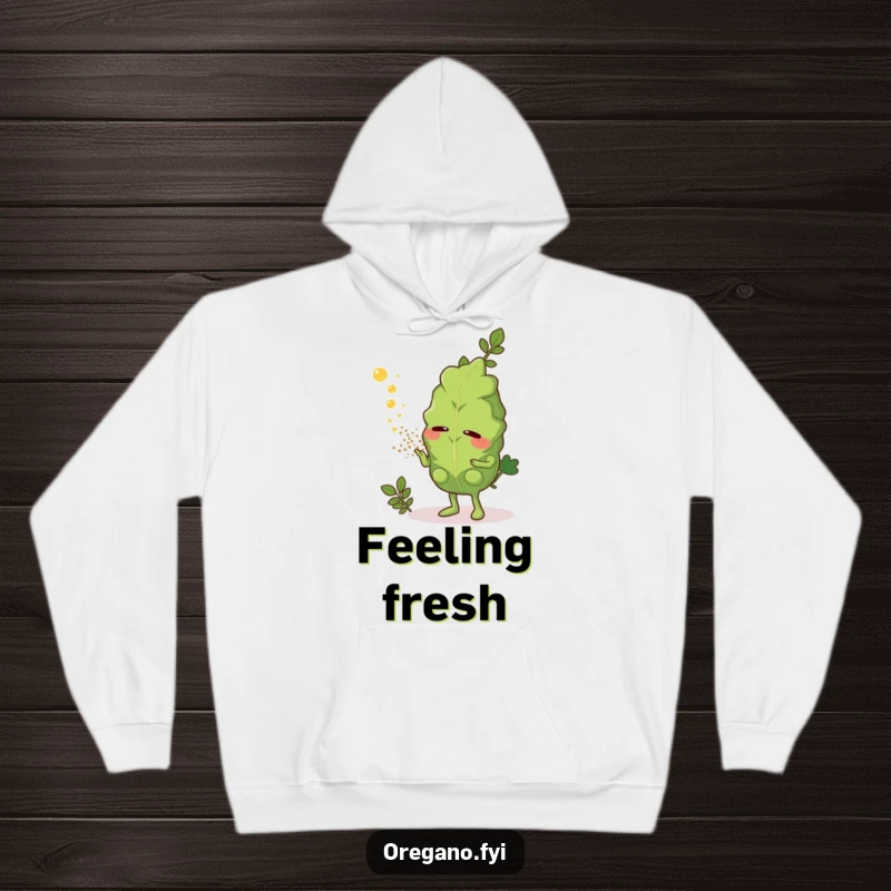 Funny hoodie showcasing an oregano leaf character sneezing a cloud of aromatic dust, a humorous design for spice lovers.