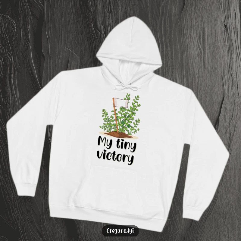 Funny Oregano Victory Flag Hoodie: A triumphant oregano sprig planting its flag, ready to celebrate achievements.