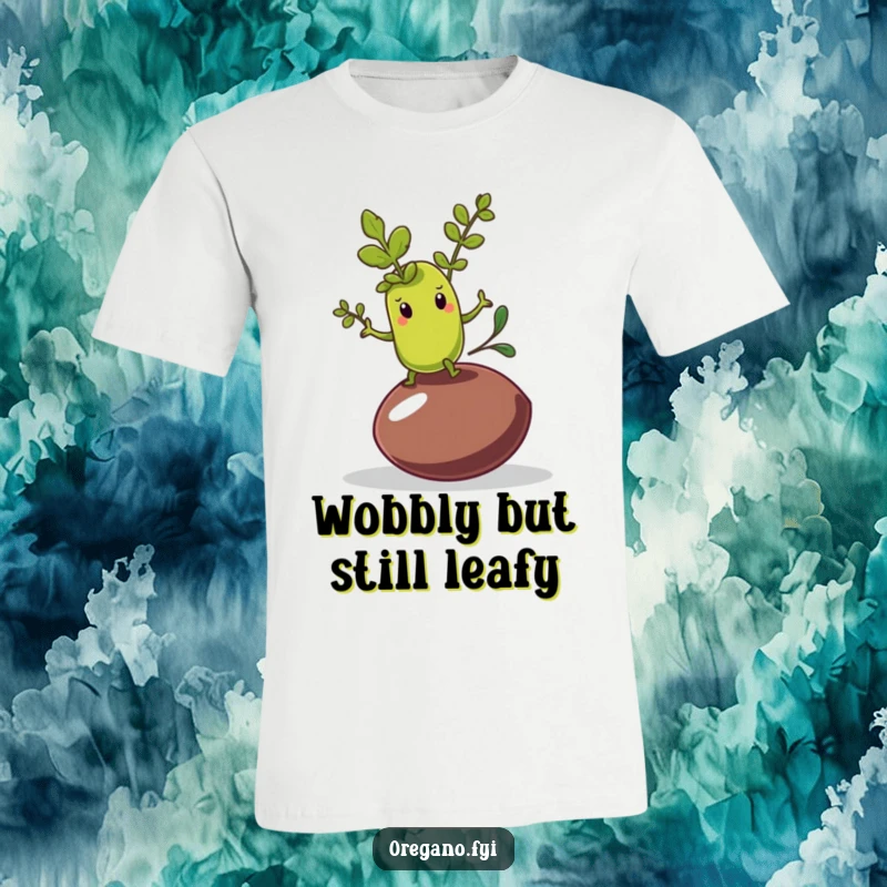 Funny t-shirt featuring an oregano leaf character wobbling while trying to maintain balance on an olive pit.